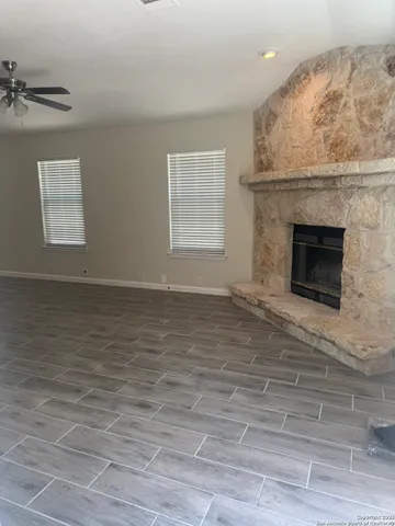 an empty room with a fireplace