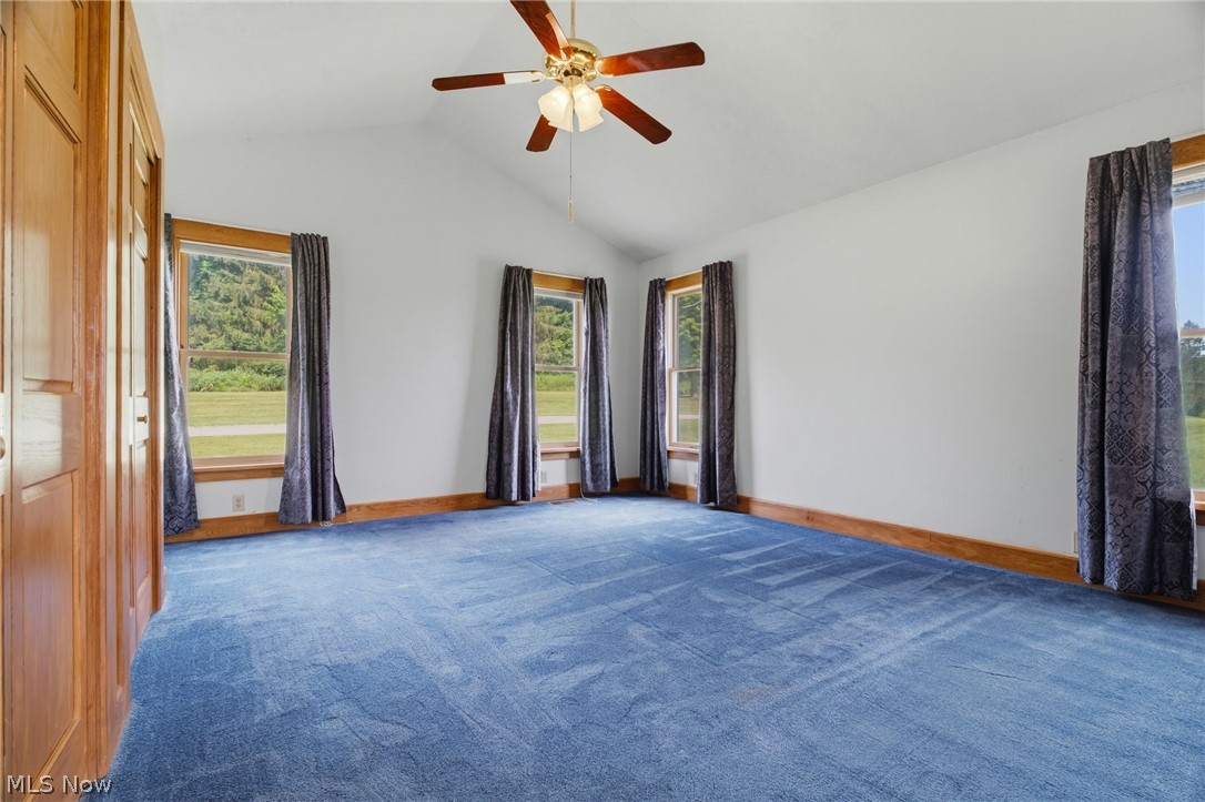 11513 Kile Road Chardon, OH 44024 - Photo 15 of 48 Floor floor bedroom with vaulted ceiling and blue carpet