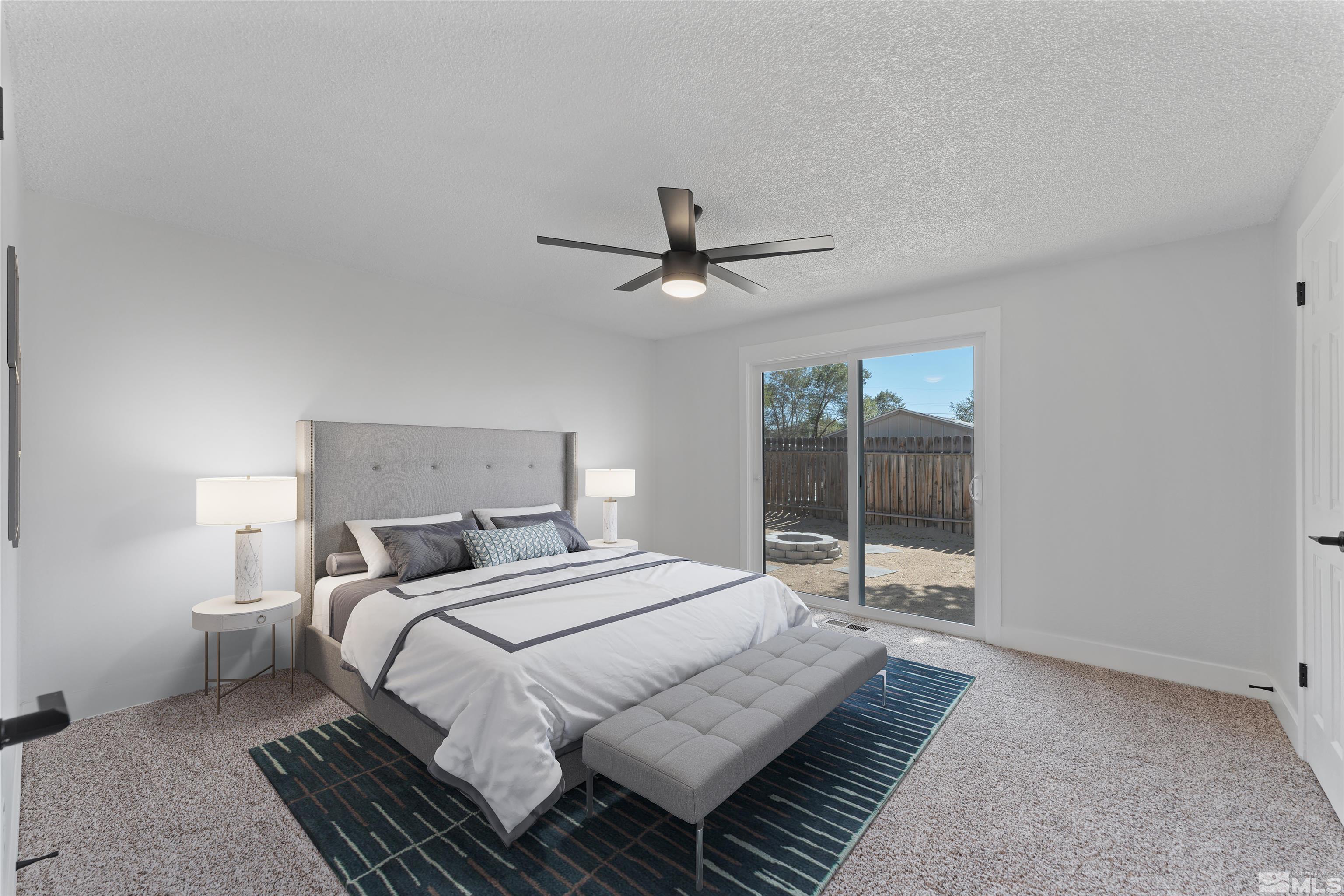 5280 Echo Avenue Reno, NV 89506 - Photo 11 of 31 a bedroom with bed and a large window