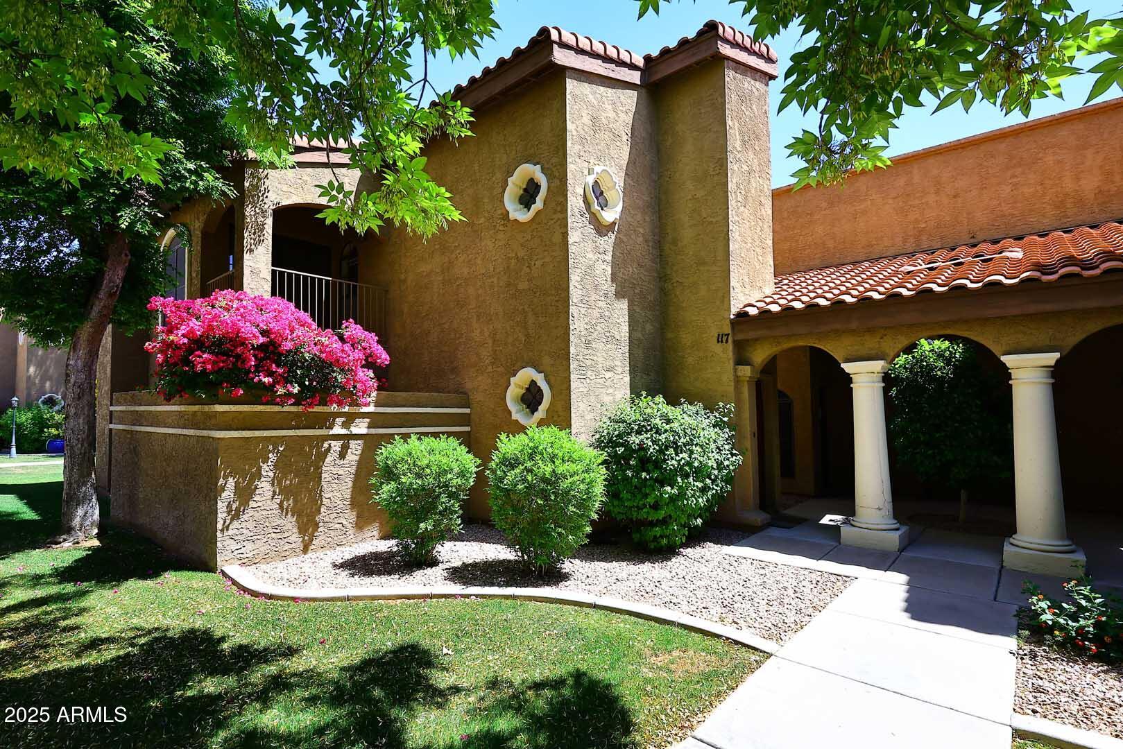 a front view of a house with yard