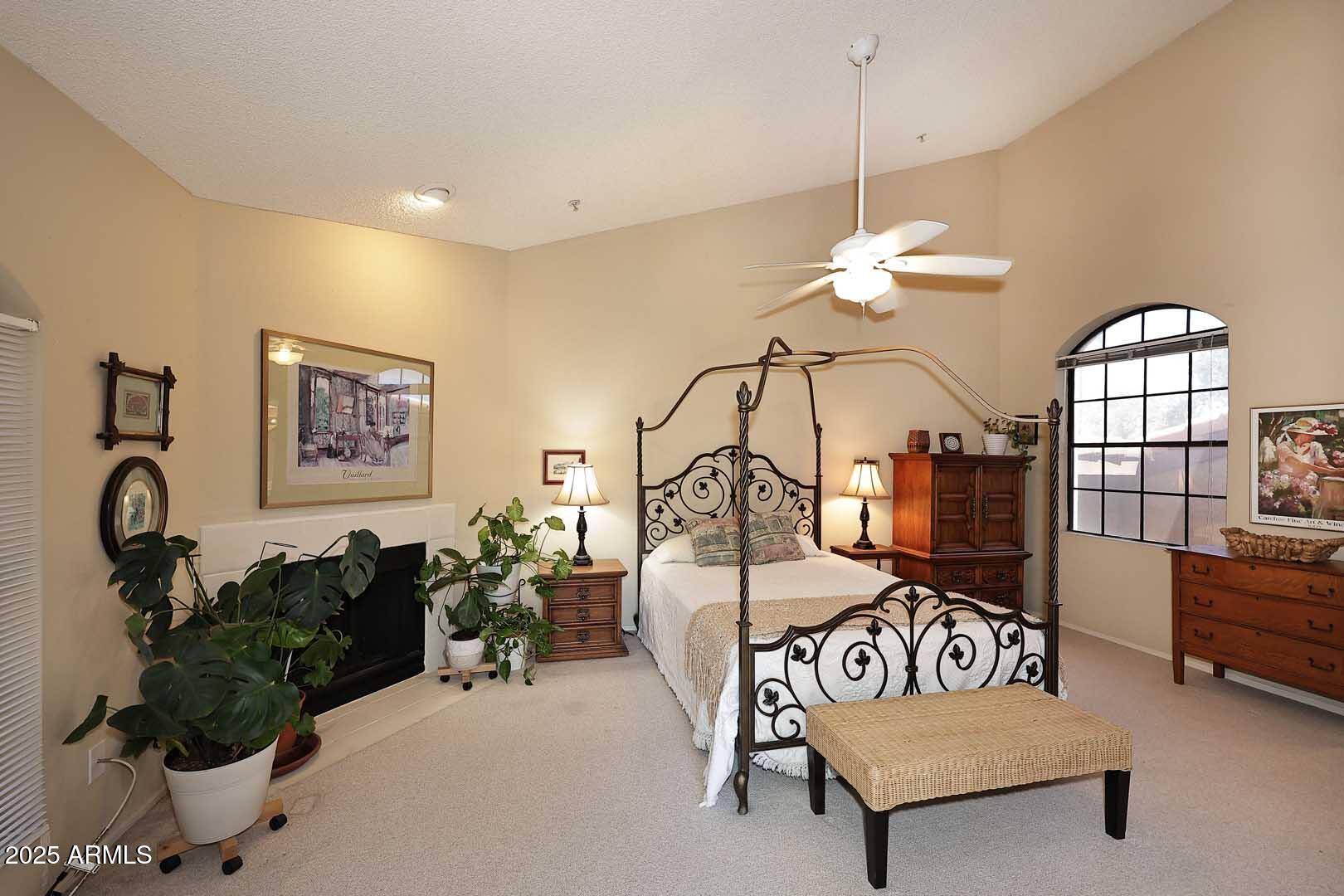 6945 East Cochise Road, Unit 117 Paradise Valley, AZ 85253 - Photo 17 of 39 a living room with furniture a chandelier and a window