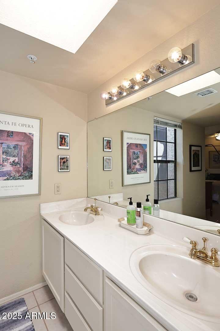 6945 East Cochise Road, Unit 117 Paradise Valley, AZ 85253 - Photo 19 of 39 a bathroom with a sink and a mirror
