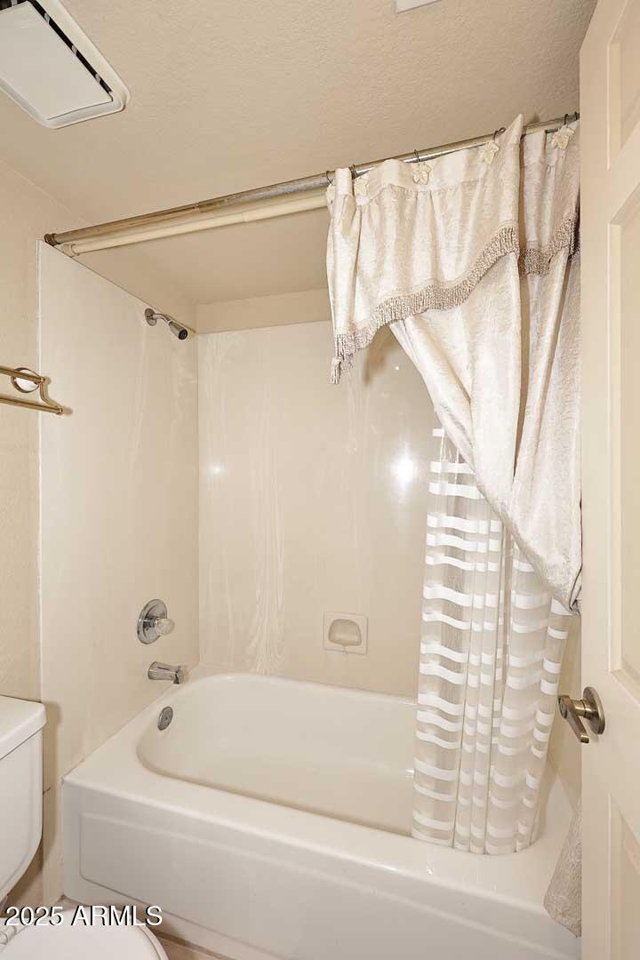 6945 East Cochise Road, Unit 117 Paradise Valley, AZ 85253 - Photo 20 of 39 a bathroom with a bathtub and a shower