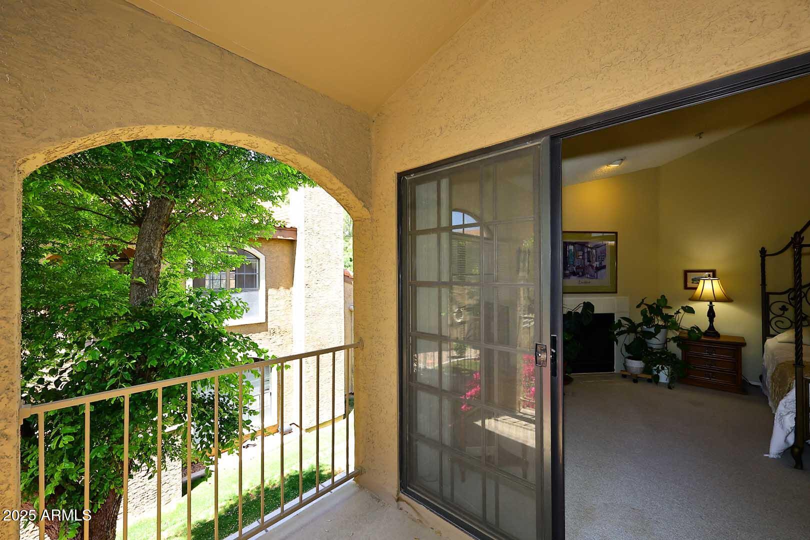 6945 East Cochise Road, Unit 117 Paradise Valley, AZ 85253 - Photo 22 of 39 a view of a porch with a furniture