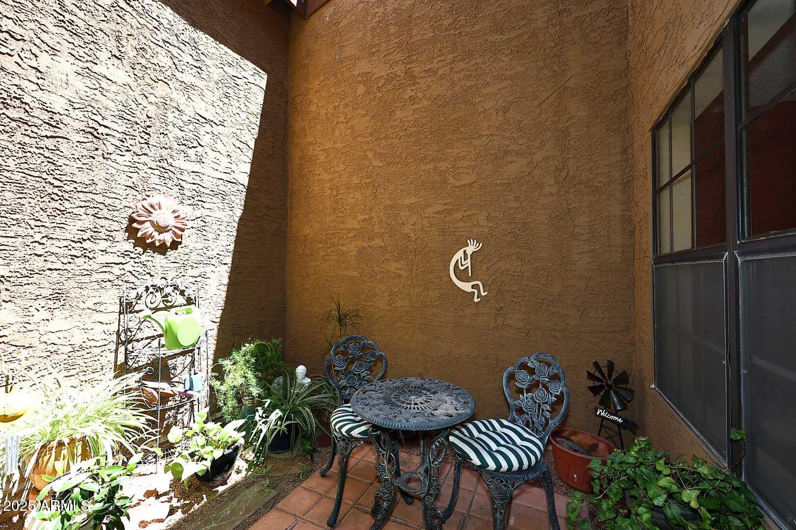6945 East Cochise Road, Unit 117 Paradise Valley, AZ 85253 - Photo 24 of 39 a bathroom with a granite countertop sink and a mirror