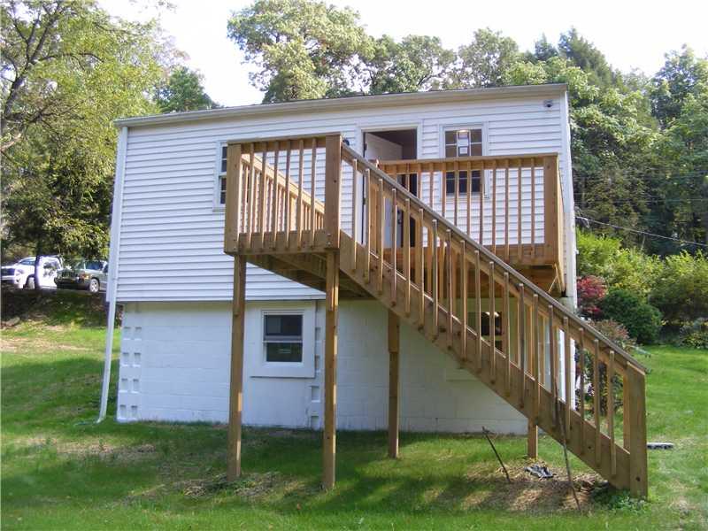 653 Winfield Road Cabot, PA 16023 - Photo 8 of 11 Patio/Deck. Deck off Kitchen overlooking back yard and creek