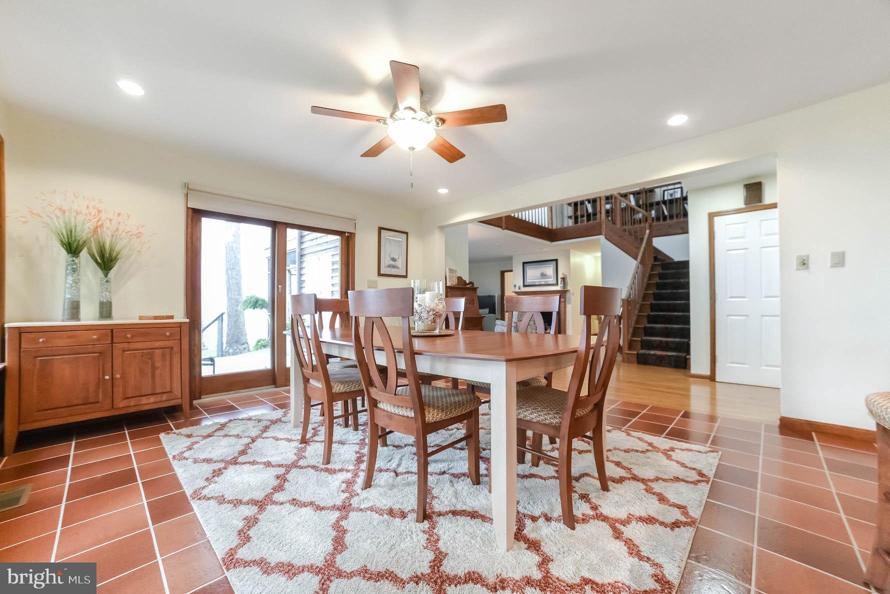 18293 River Road Tall Timbers, MD 20690 - Photo 32 of 62 Dining room with slider to deck