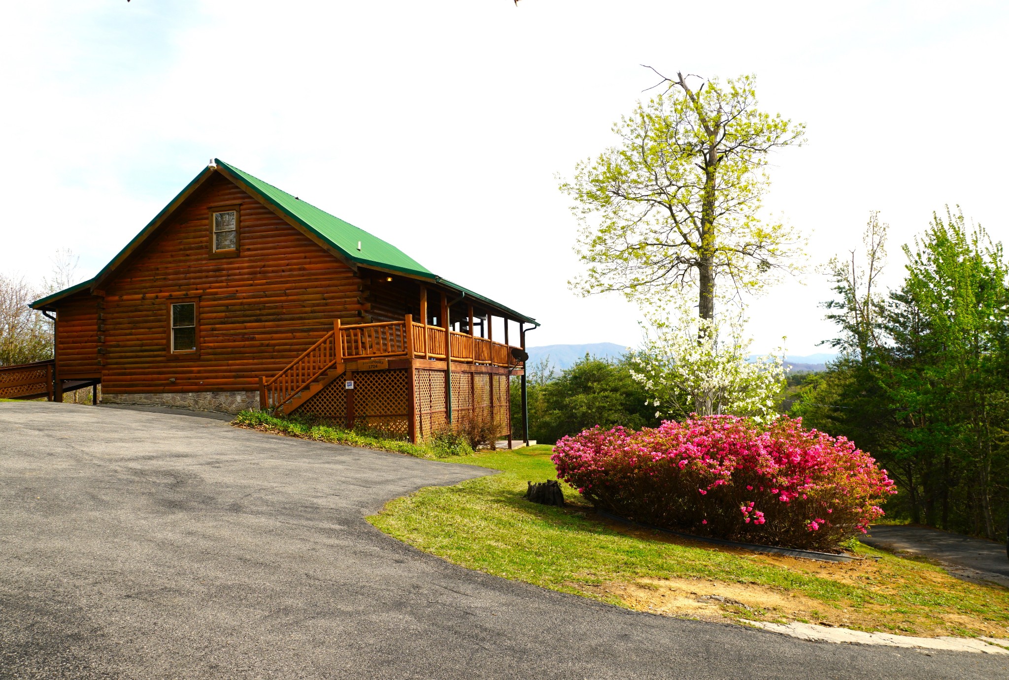1724 Bluff Ridge Road Sevierville, TN 37876 - Photo 1 of 29 a front view of a house with a garden