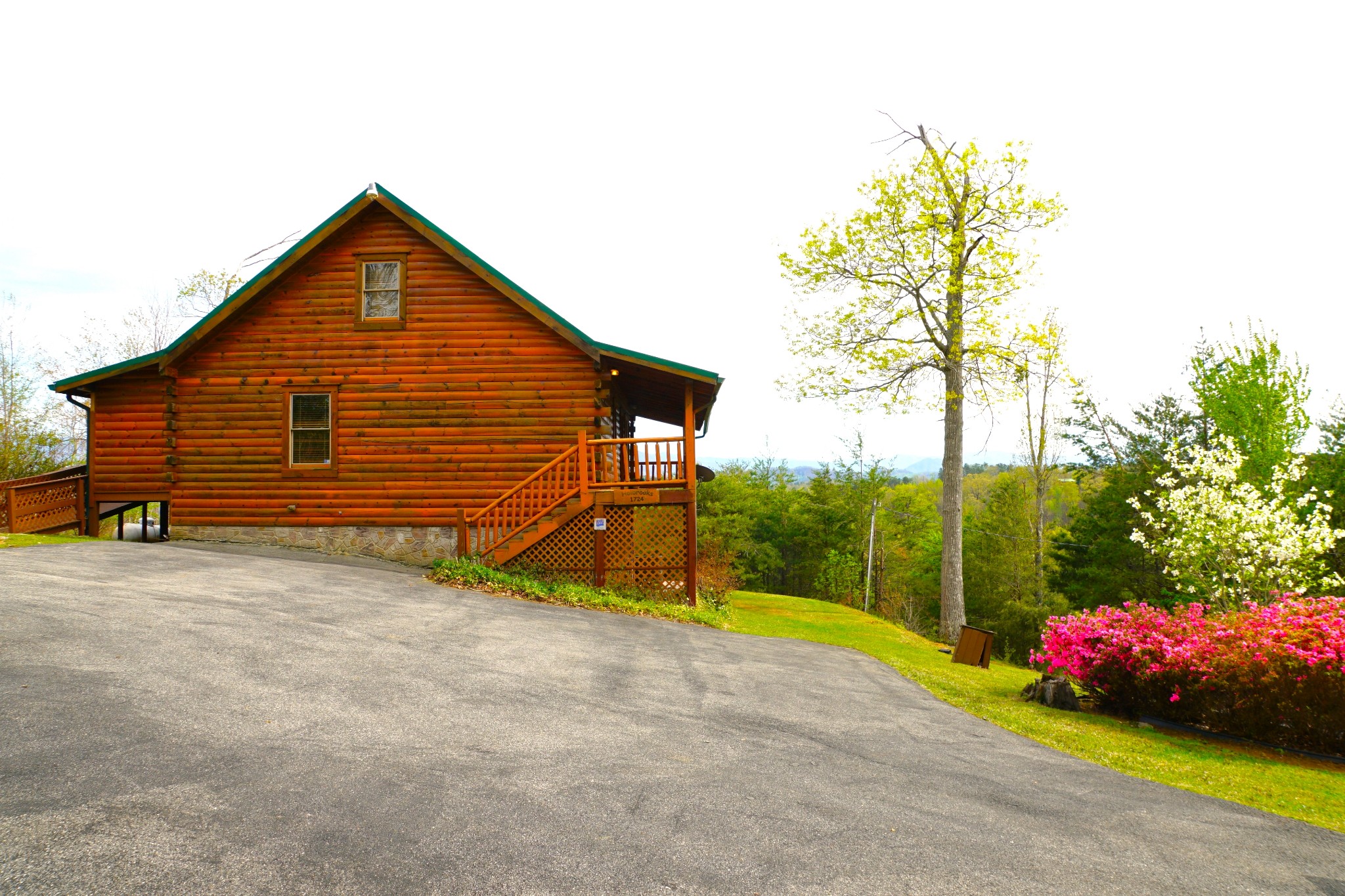 1724 Bluff Ridge Road Sevierville, TN 37876 - Photo 16 of 29 a view of backyard with a garden and entertaining space