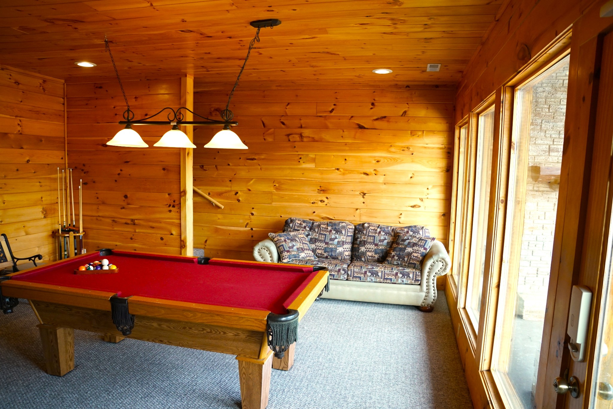 1724 Bluff Ridge Road Sevierville, TN 37876 - Photo 20 of 29 a bedroom with furniture and a chandelier