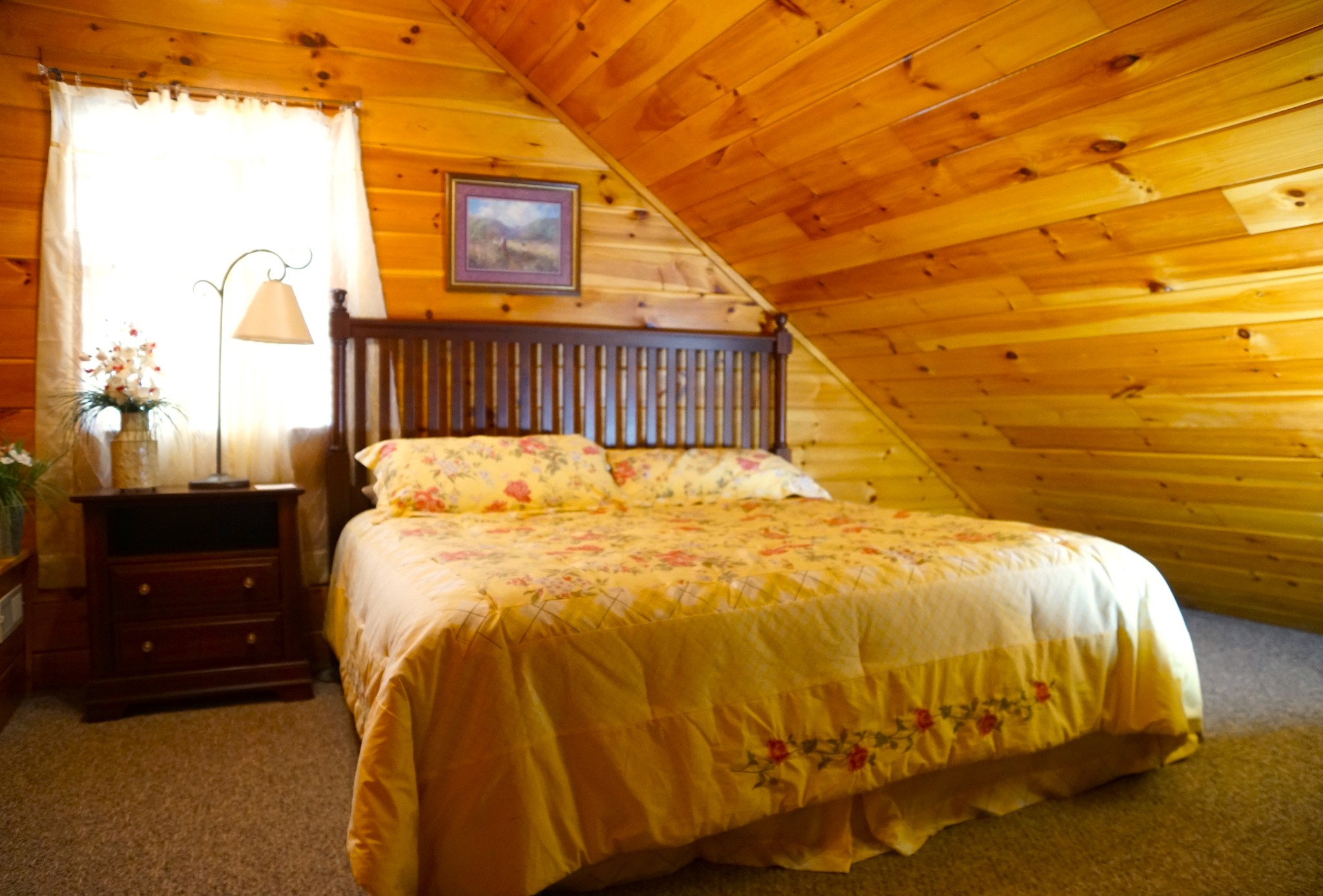 1724 Bluff Ridge Road Sevierville, TN 37876 - Photo 26 of 29 a bed sitting in a bedroom next to a window