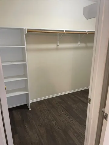 a view of an empty walk in closet