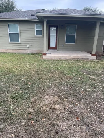 a house view with a backyard space