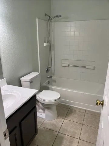 a bathroom with a toilet a sink and shower