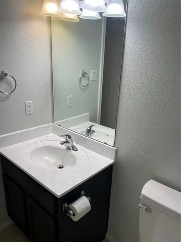 a bathroom with a sink and a toilet