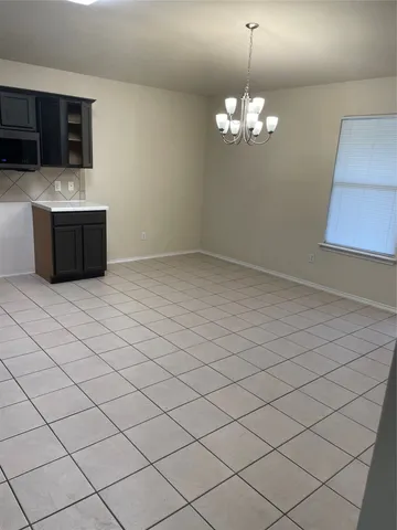 a view of an empty room with a fireplace