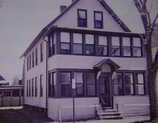 29-31 Gardner Street Springfield, MA 01105 - Photo 1 of 1 a view of a brick house with large windows and a table