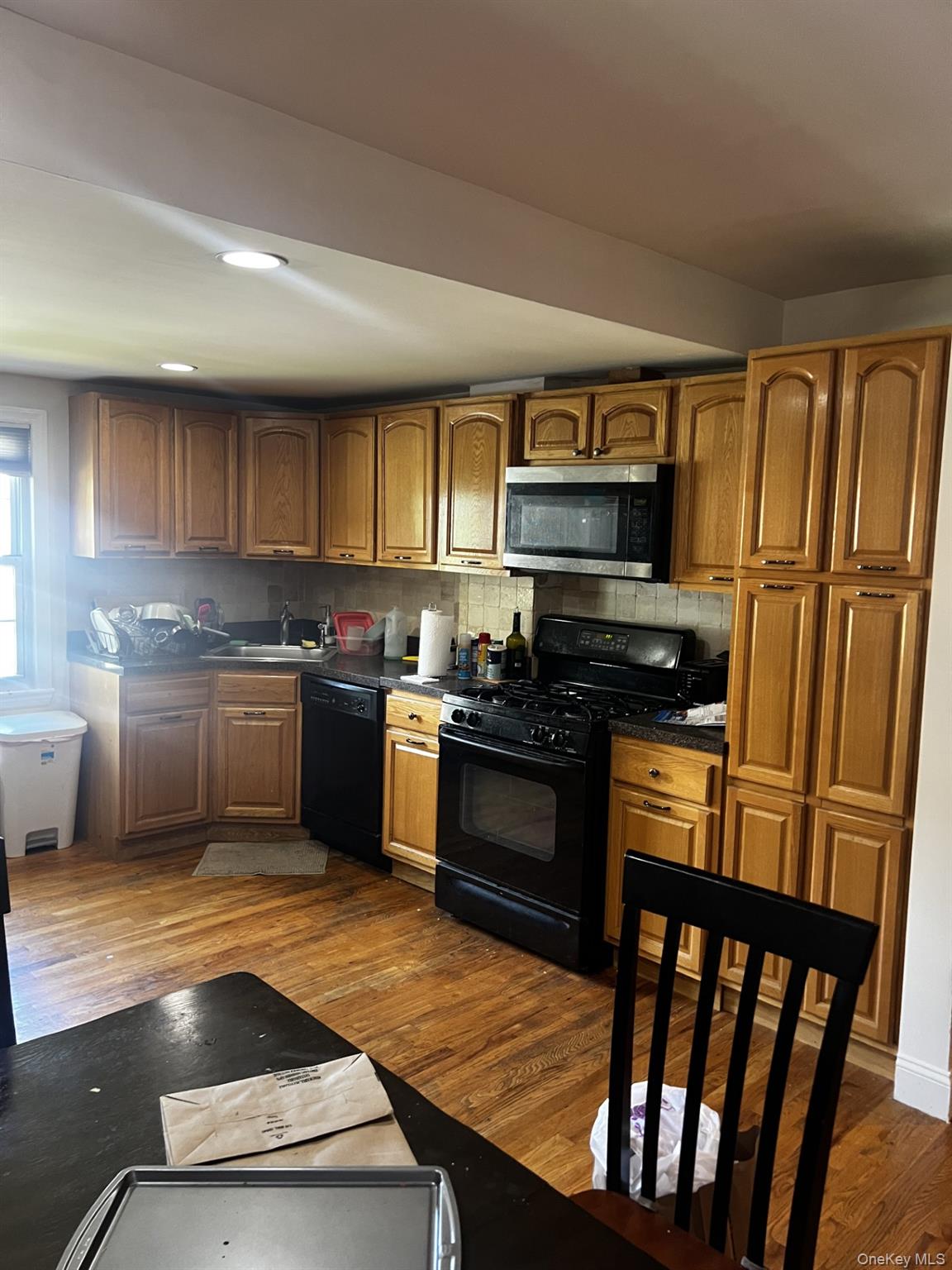 349 County Center Road, Unit TOP White Plains, NY 10603 - Photo 9 of 17 a kitchen with granite countertop a refrigerator stove top oven and sink