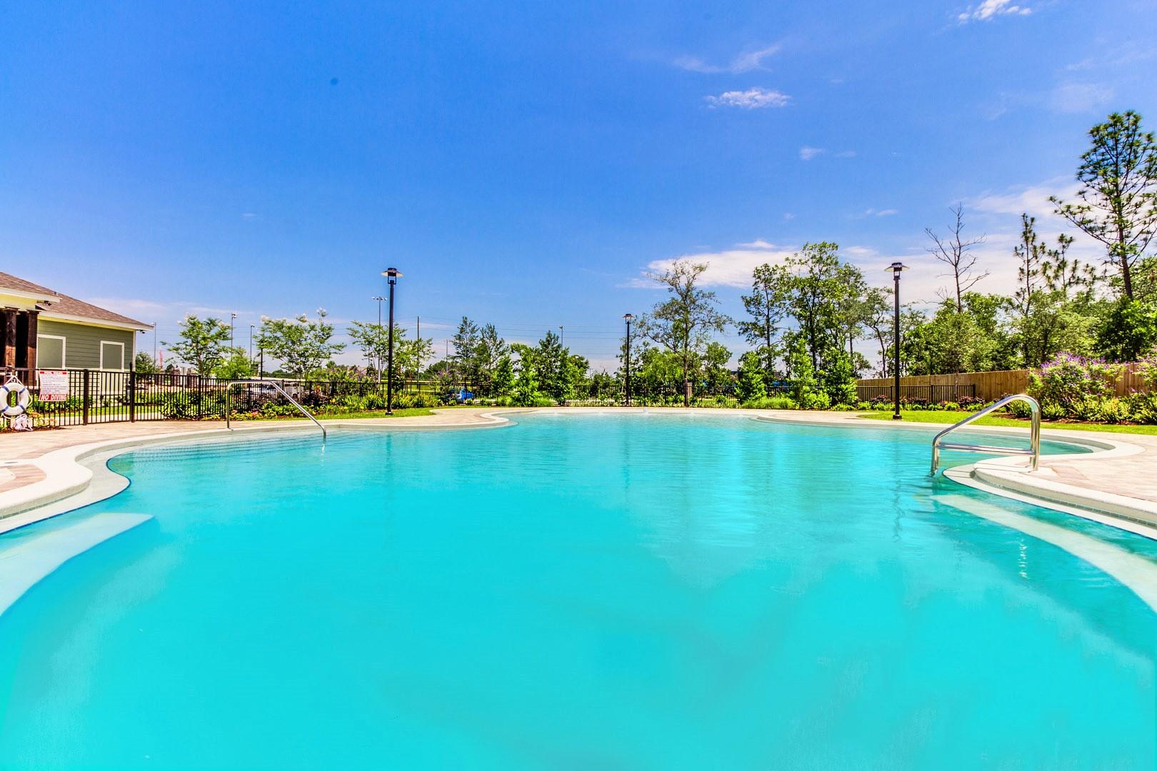 303 Merlin Court Crestview, FL 32539 - Photo 14 of 18 a view of a swimming pool with an outdoor space and seating area