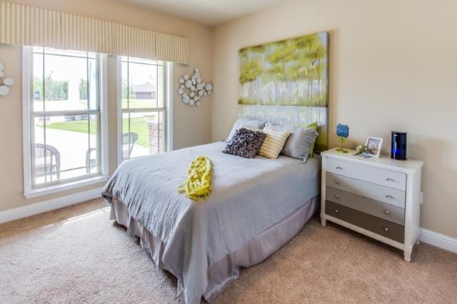 303 Merlin Court Crestview, FL 32539 - Photo 6 of 18 a bedroom with a bed and a large window