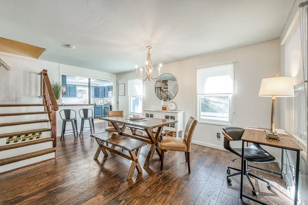a dining room with furniture and window
