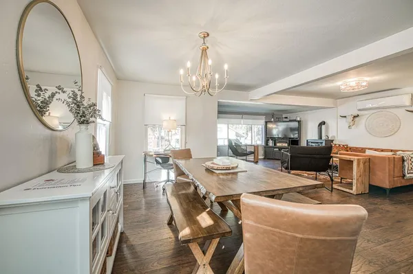 a kitchen with kitchen island a refrigerator stove and sink