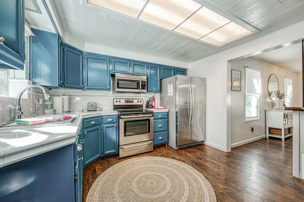 a bedroom with a bed and ceiling fan