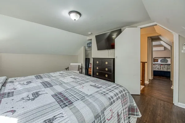 a bedroom with two beds and a window