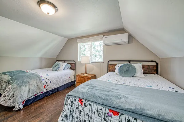 a view of a house with a yard and pathway