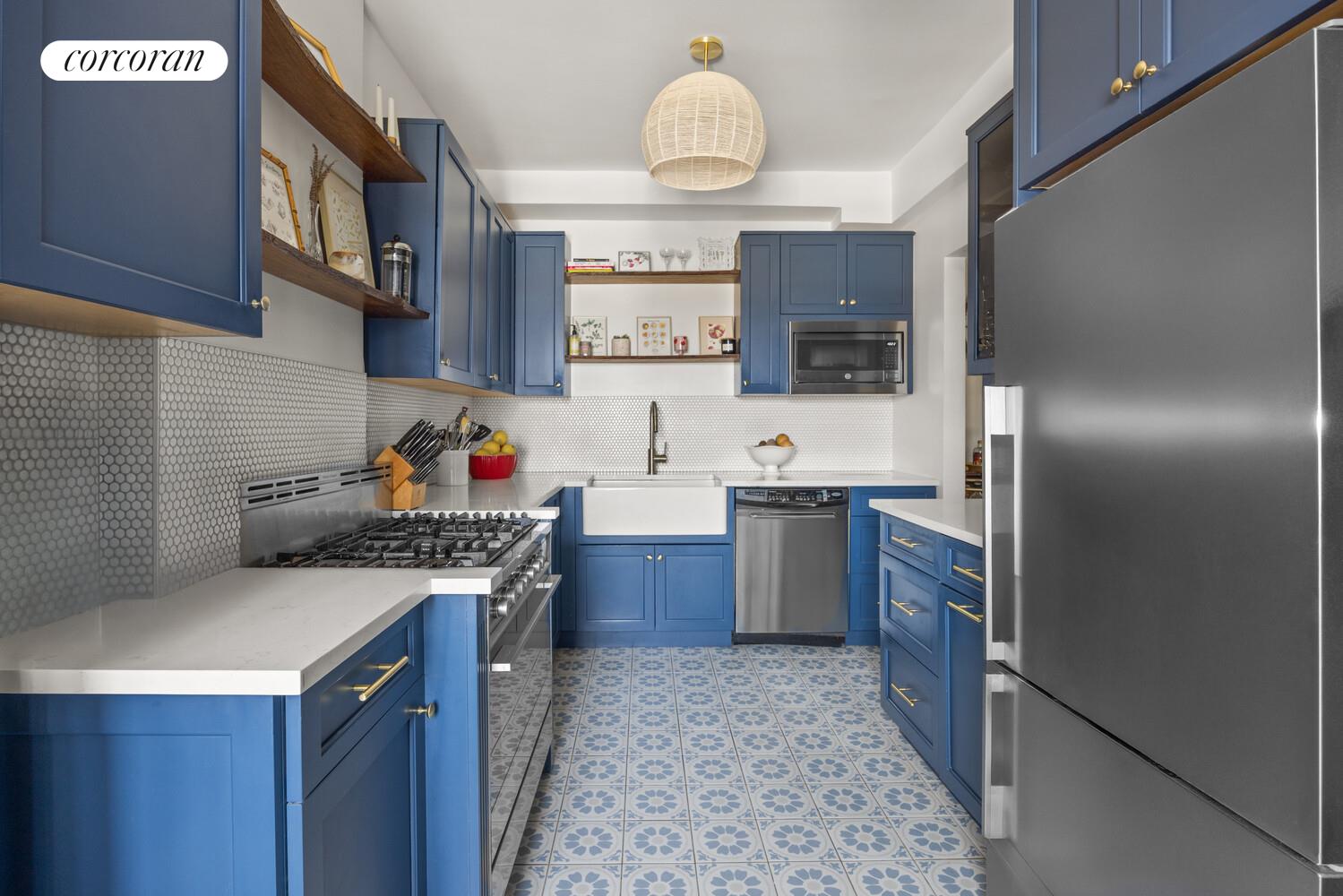 303 Beverley Road, Unit 9K Brooklyn, NY 11218 - Photo 3 of 10 a kitchen with stainless steel appliances granite countertop a sink stove and refrigerator