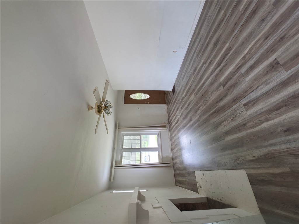3109 Shroyer Road Kettering, OH 45429 - Photo 4 of 25 Bright interior features wood flooring and natural light from a window and a door.