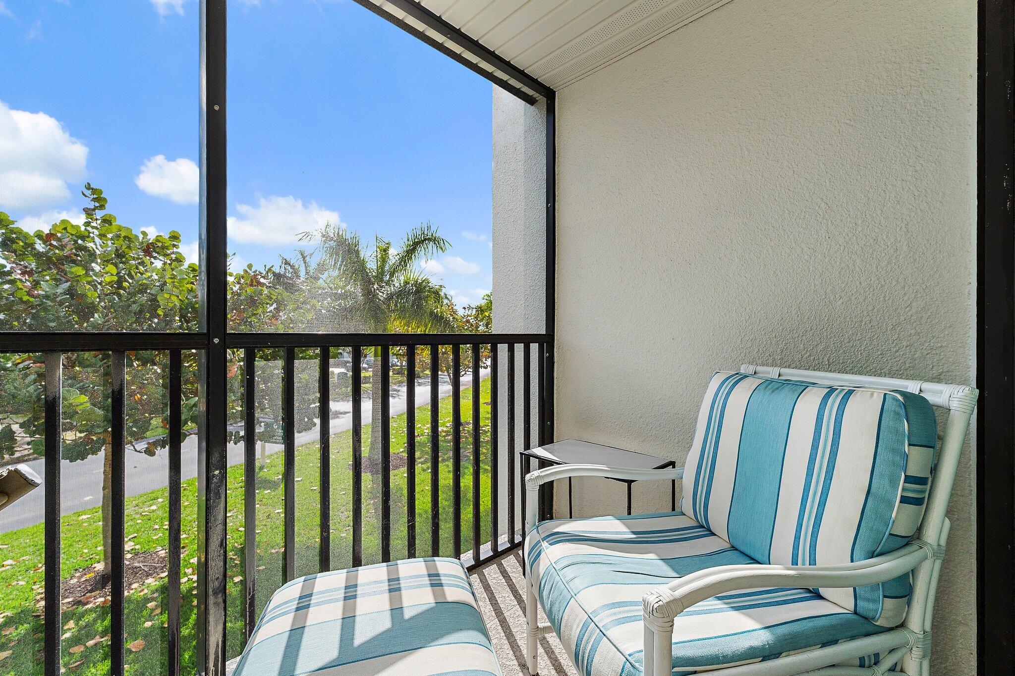 1605 Highway 1, Unit V2204 Jupiter, FL 33477 - Photo 30 of 36 a view of a balcony with chair and floor to ceiling window