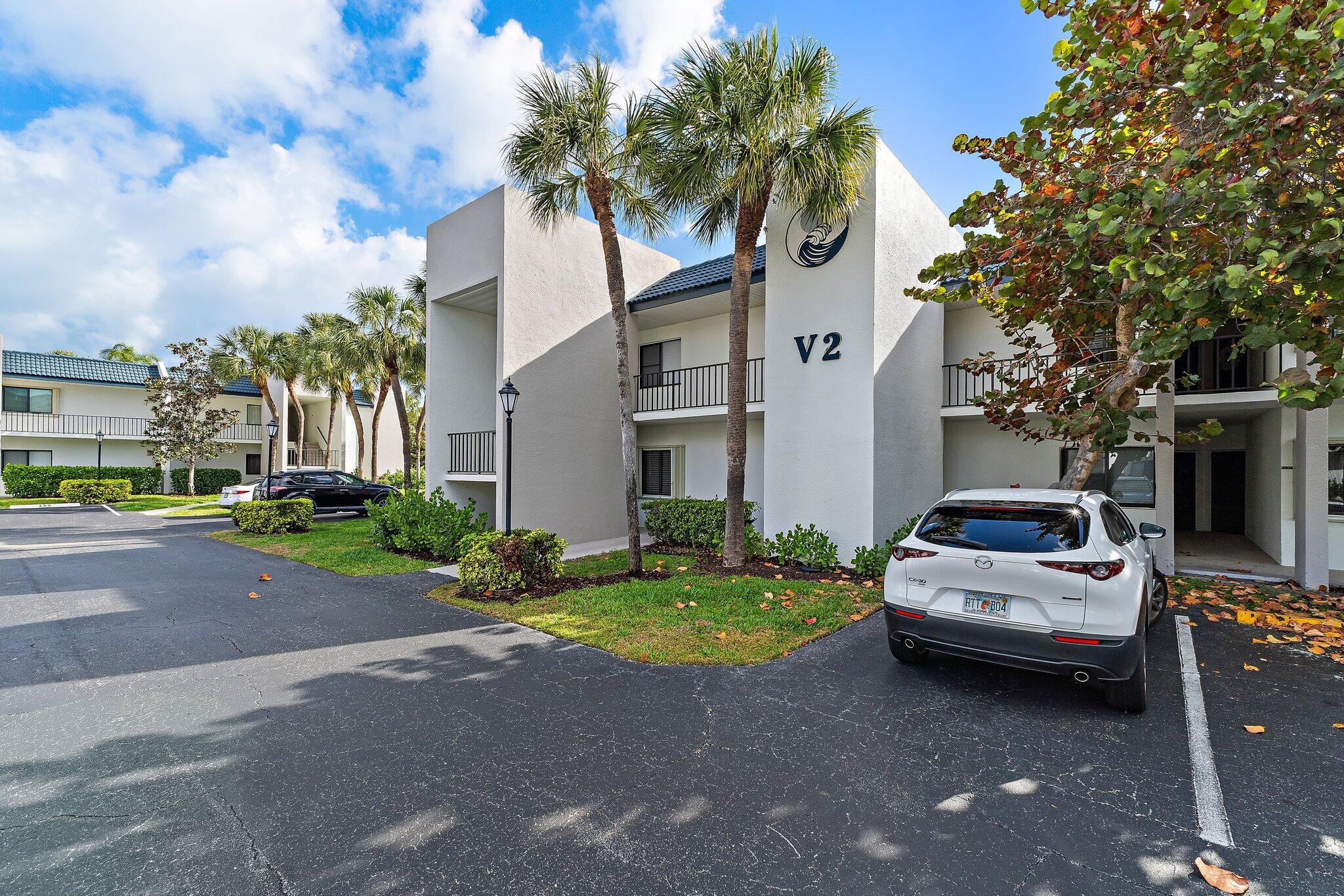 1605 Highway 1, Unit V2204 Jupiter, FL 33477 - Photo 3 of 36 a car parked in front of a house