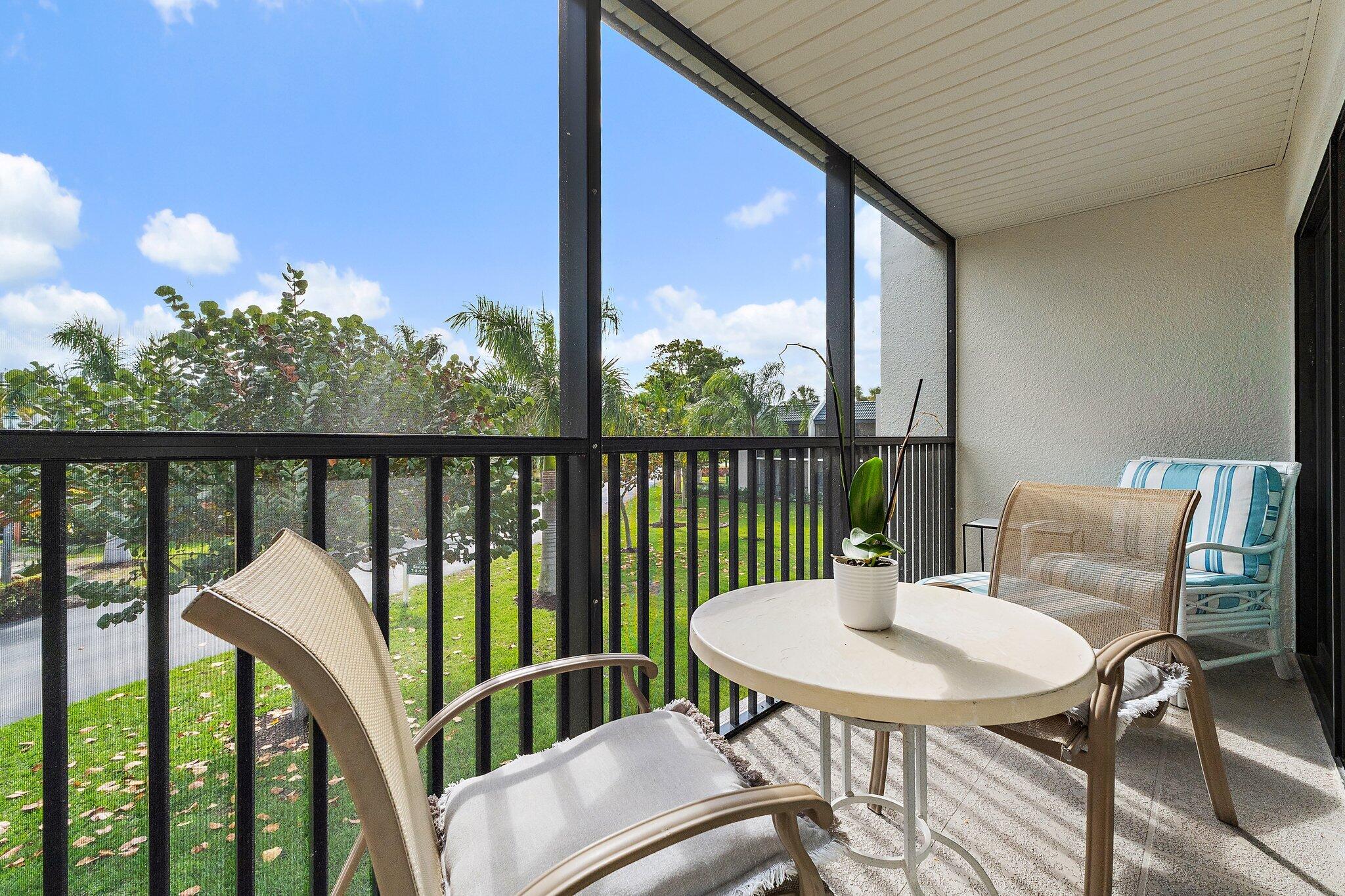 1605 Highway 1, Unit V2204 Jupiter, FL 33477 - Photo 31 of 36 a view of a balcony with a table and chairs