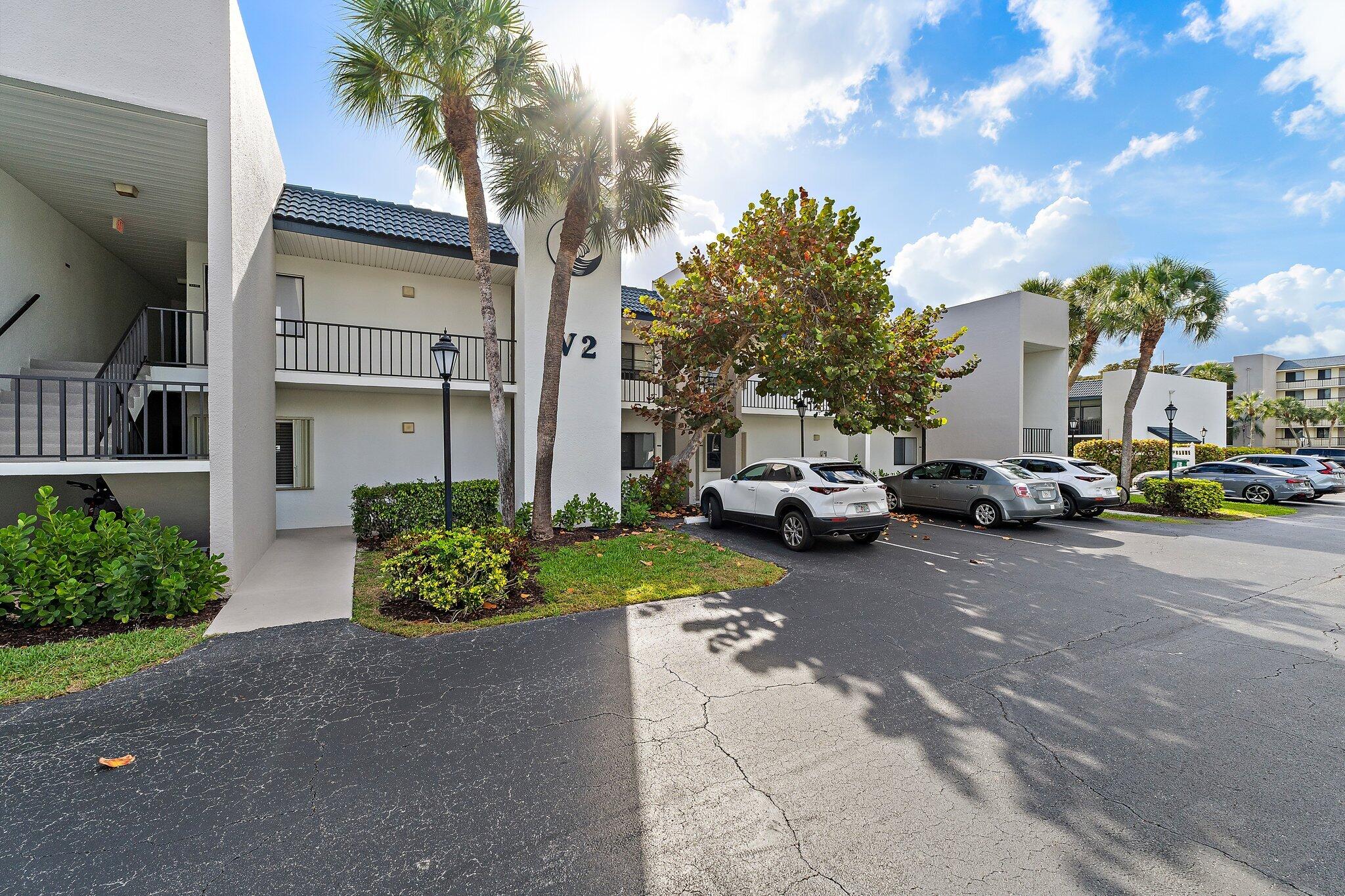 1605 Highway 1, Unit V2204 Jupiter, FL 33477 - Photo 4 of 36 a view of a street with cars