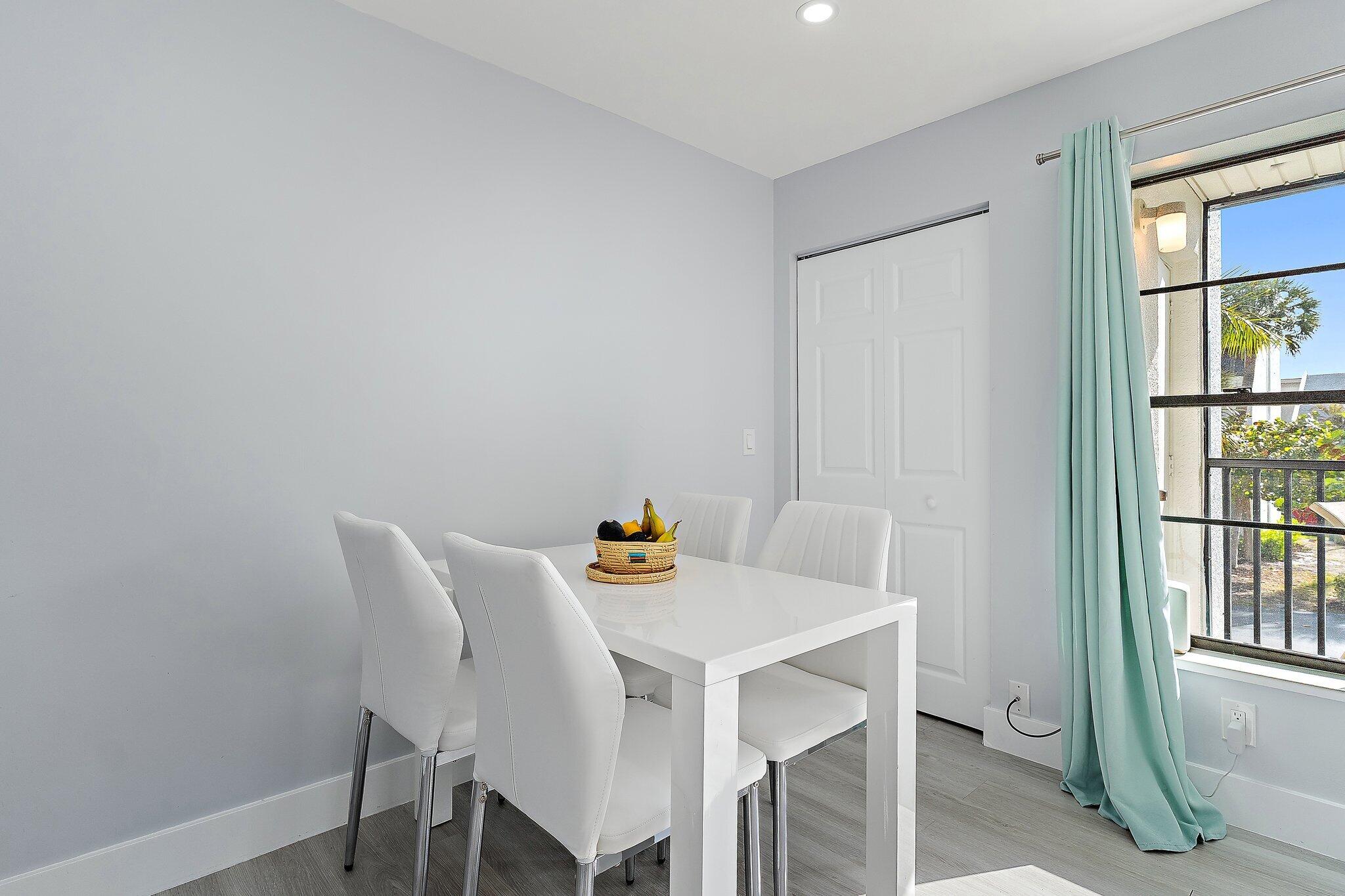 1605 Highway 1, Unit V2204 Jupiter, FL 33477 - Photo 9 of 36 a view of a dining area in a house