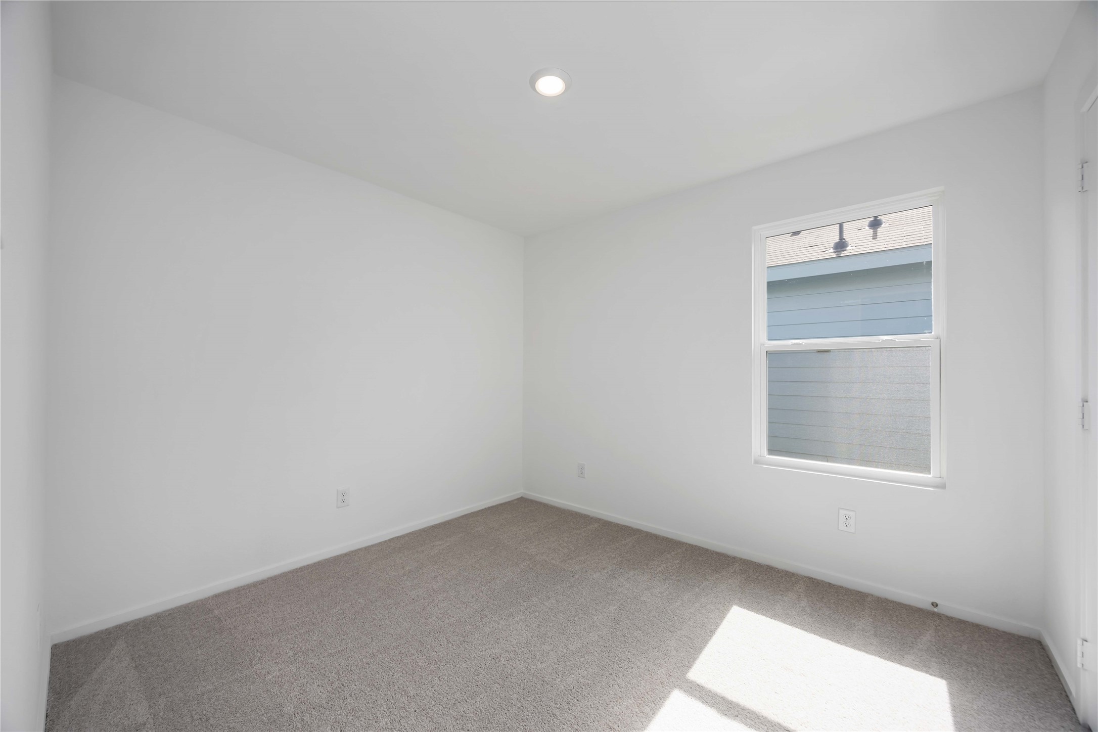 385 Lucia Way Cleveland, TX 77327 - Photo 17 of 30 an empty room with a window