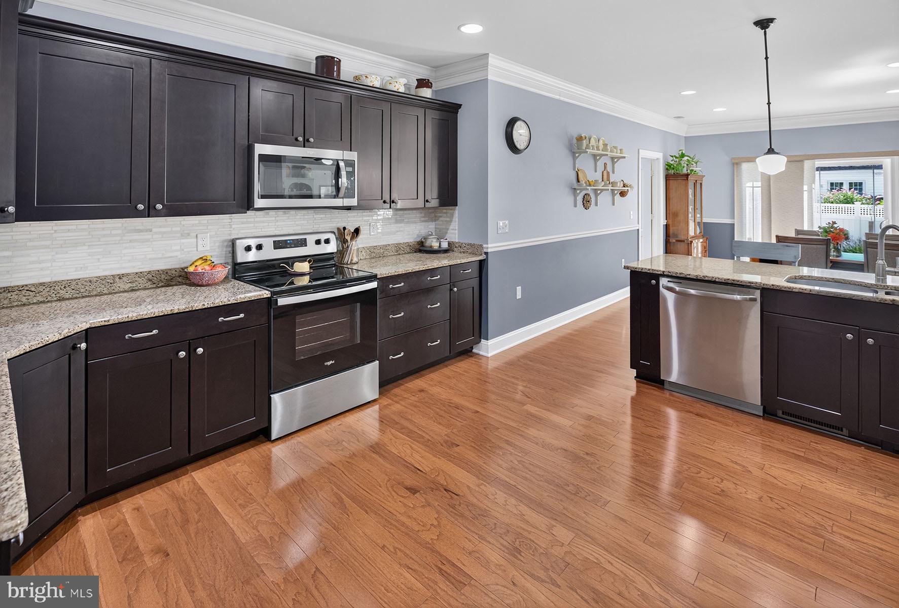 16853 Lancaster Road Lewes, DE 19958 - Photo 16 of 89 Open flow between spaces for effortless hosting.