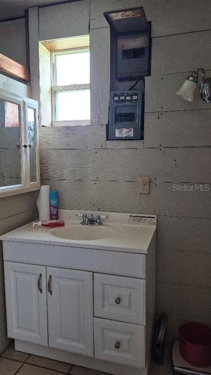 730 Stremma Road Largo, FL 33770 - Photo 7 of 7 a bathroom with a sink and a mirror