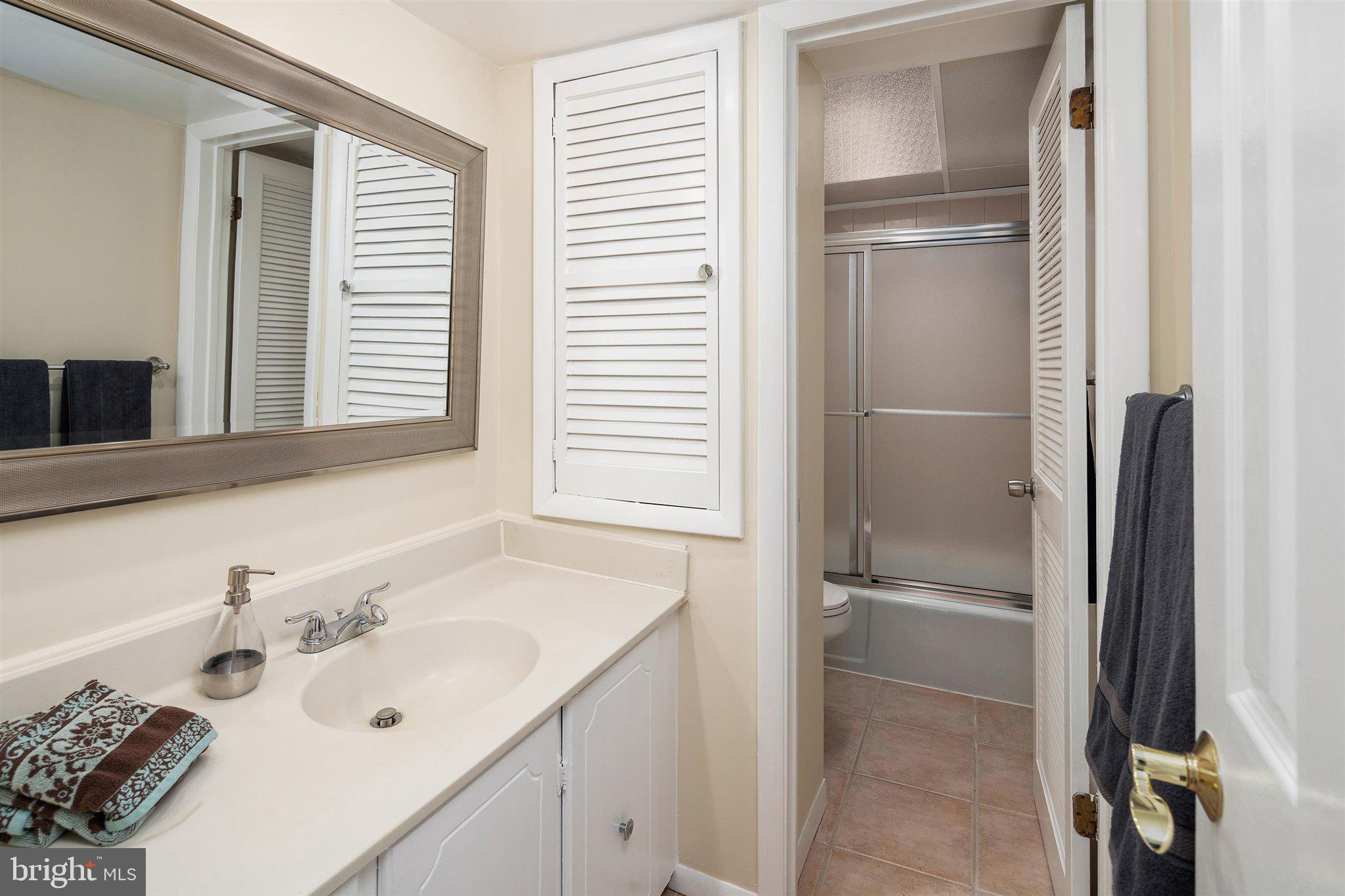 6 Ginger Road Chesterfield, NJ 08515 - Photo 15 of 48 a bathroom with a sink and a large mirror