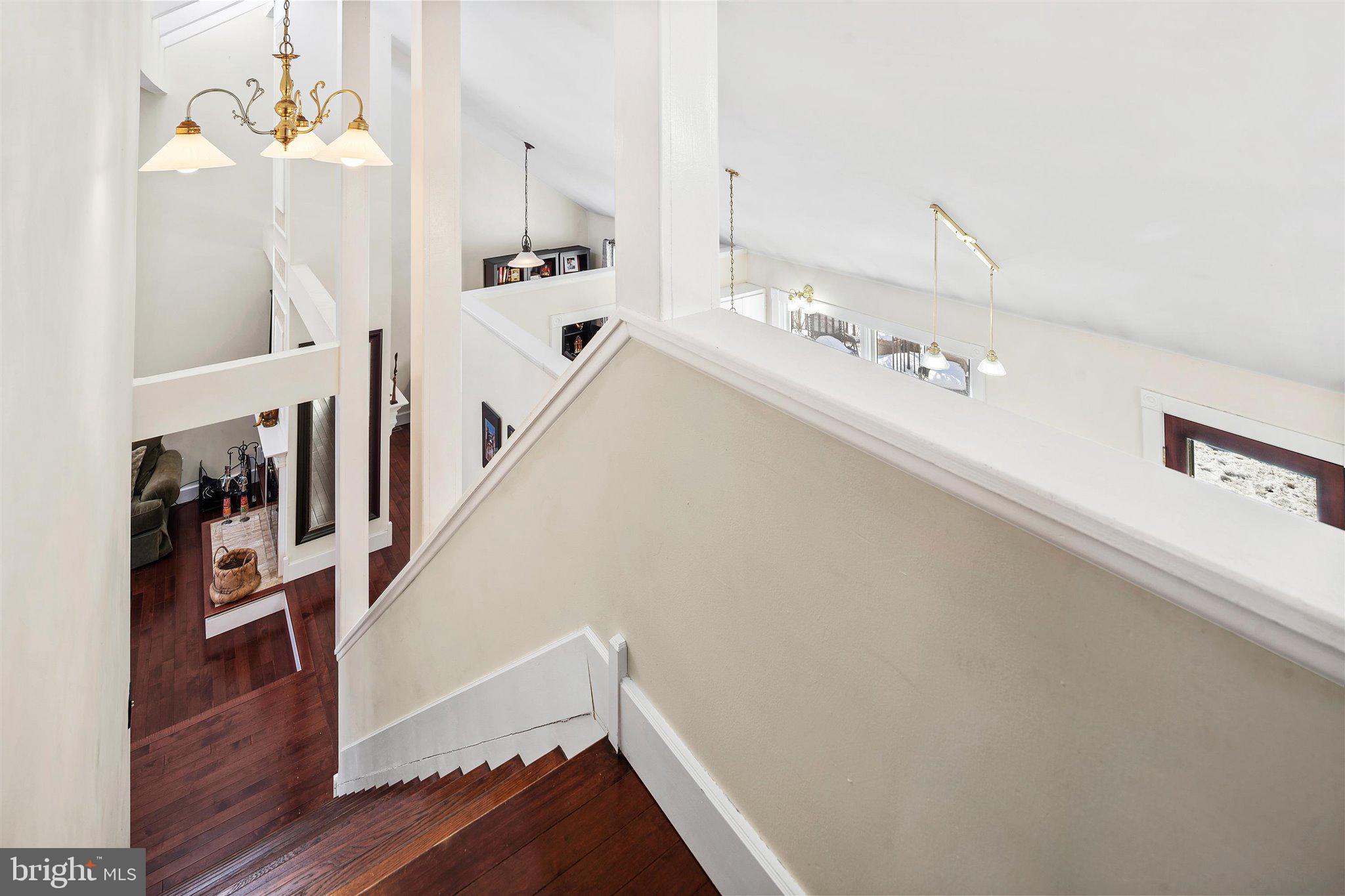 6 Ginger Road Chesterfield, NJ 08515 - Photo 22 of 48 a view of a hallway with wooden floor and staircase