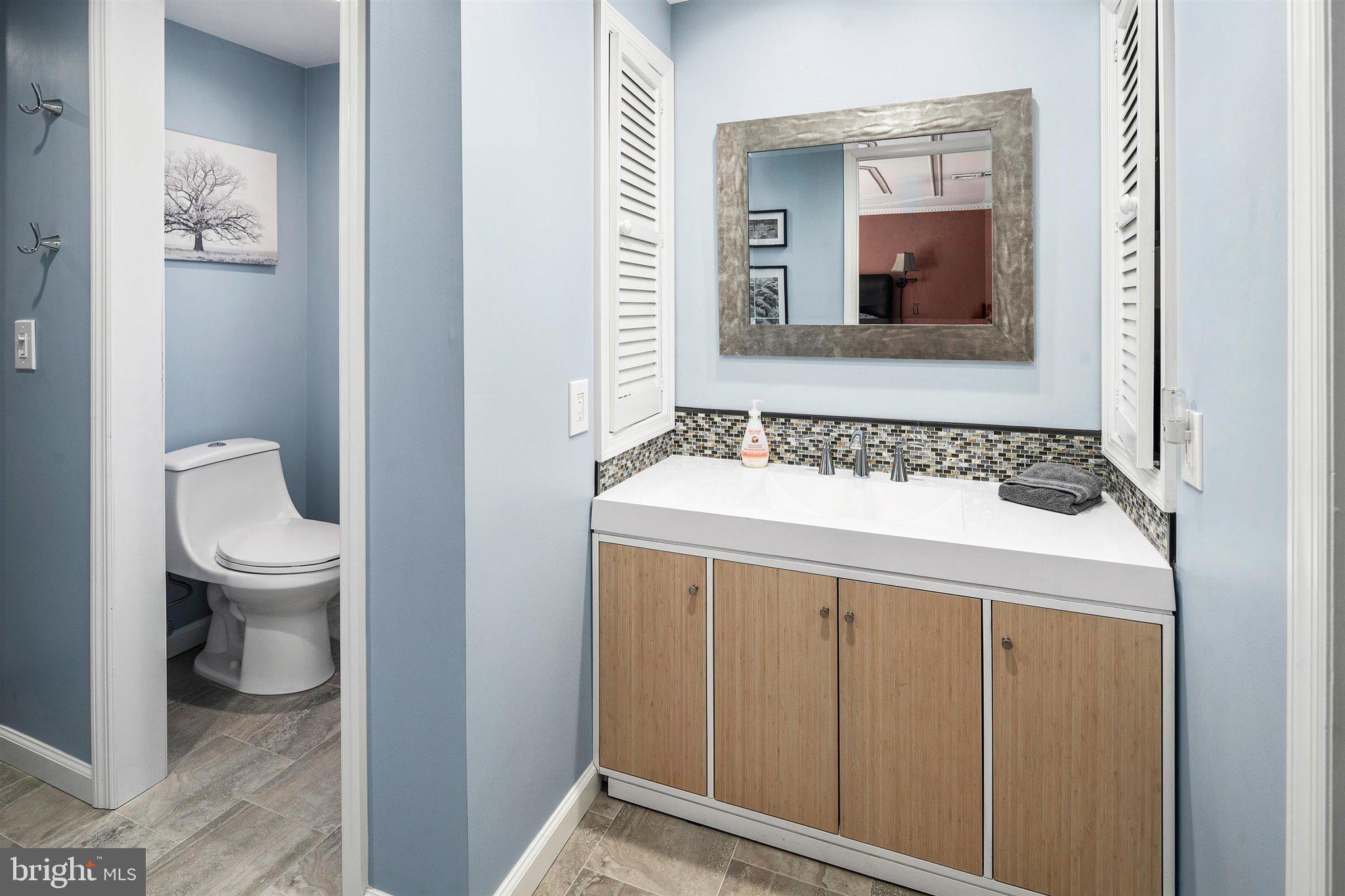 6 Ginger Road Chesterfield, NJ 08515 - Photo 33 of 48 a bathroom with a toilet sink and mirror