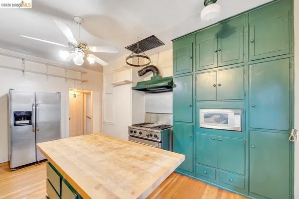 a kitchen with cabinets and window