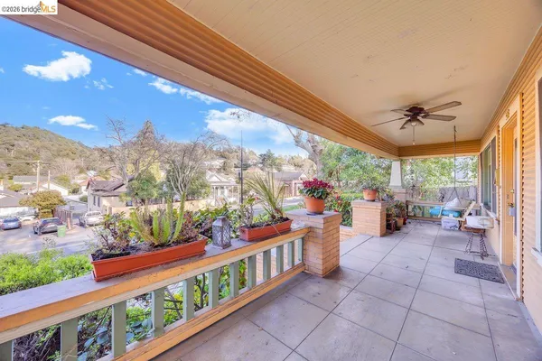 a view of a chairs and tables in the balcony