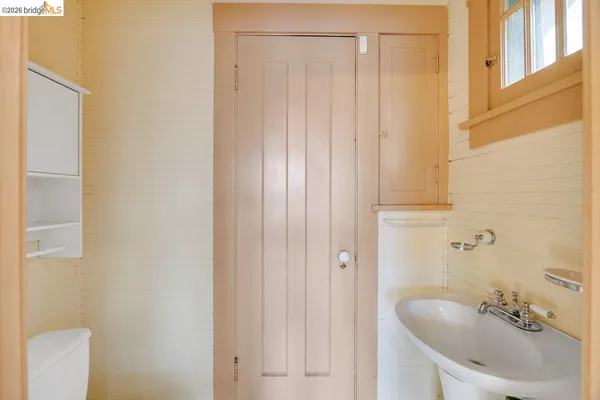 a bathroom with a tub and sink