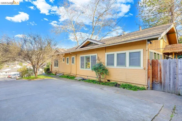 a view of road with house in the background