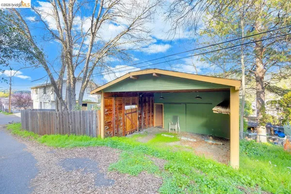 a view of living room with furniture and a window