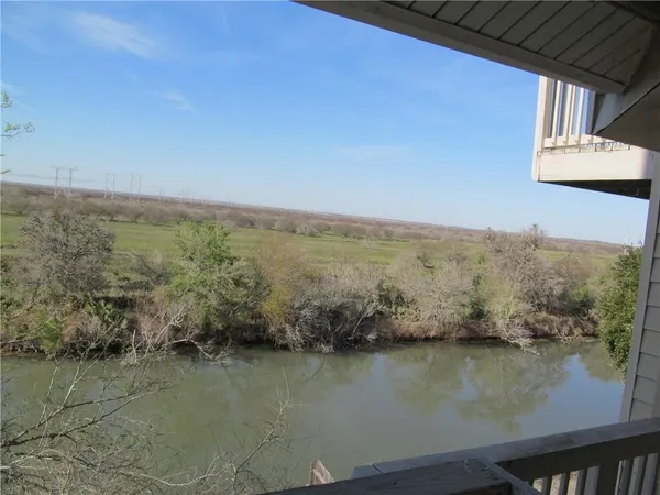 a view of a porch with a floor to ceiling window