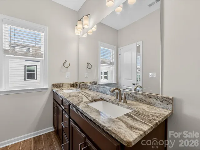 a view of kitchen island a sink and living room