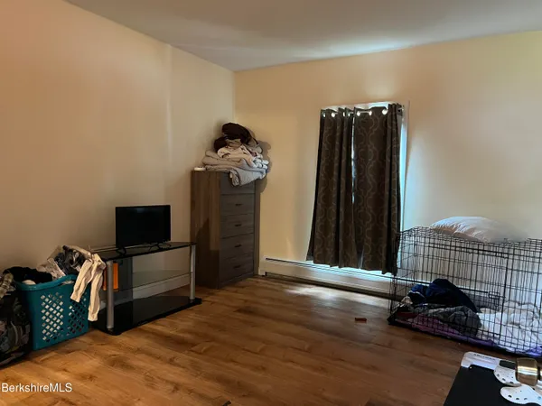 a bathroom with a sink toilet and a mirror